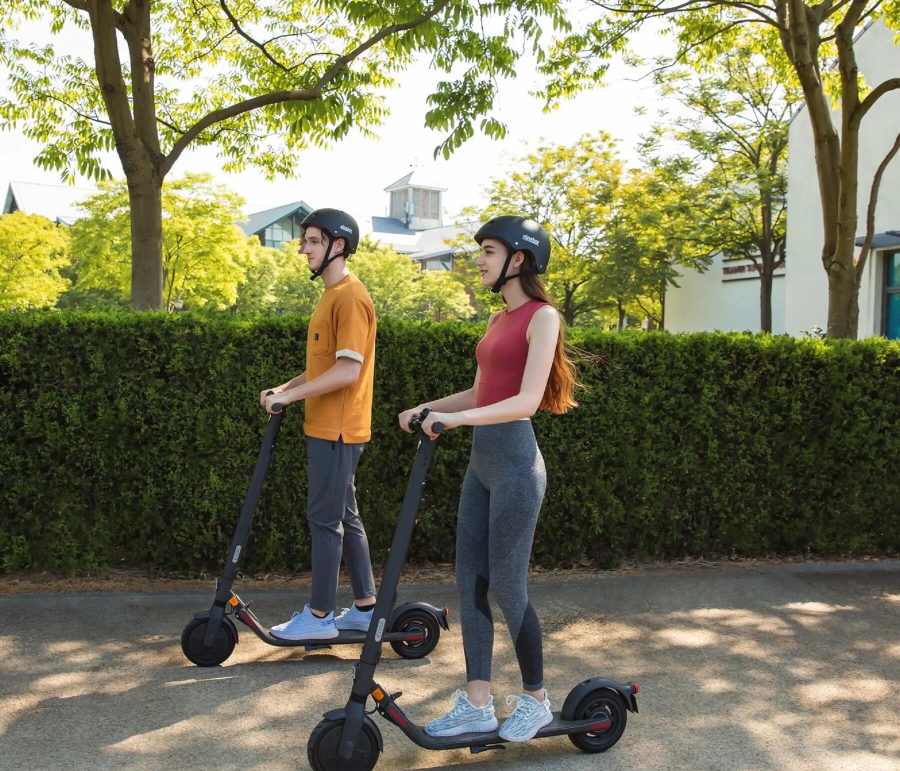 man and woman going on a scooter ride