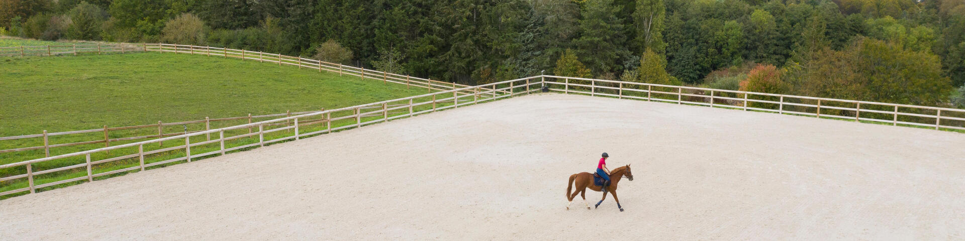 person riding a horse in a practice area