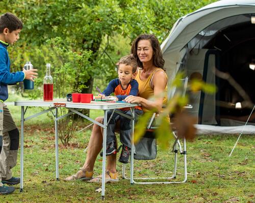 Mum and kids camping outside. 