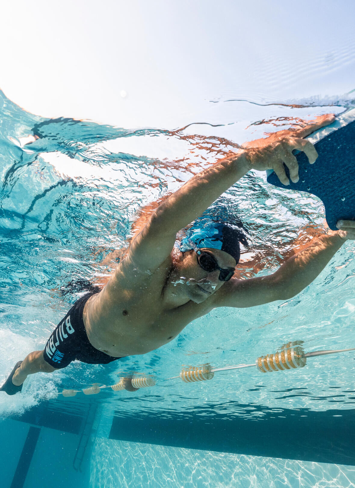 Swimming: Why swim with a board and flippers?