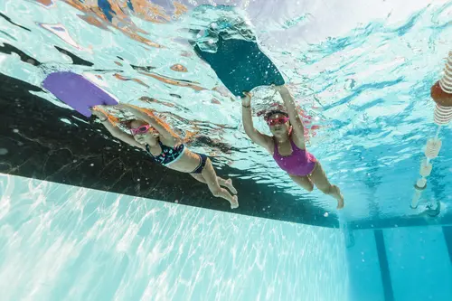 Image of 3 persons using stand-up paddles