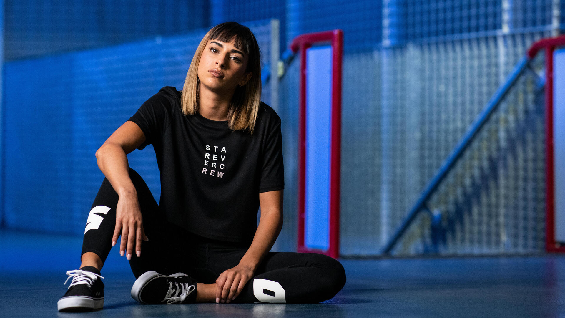 woman sitting down ready to practice urban dance