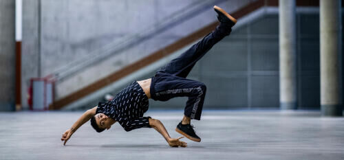 urban dancer doing a complex move