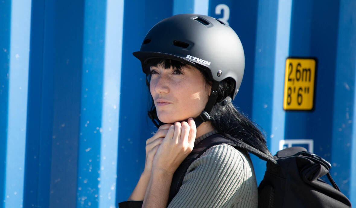 woman tying her bicycle helmet