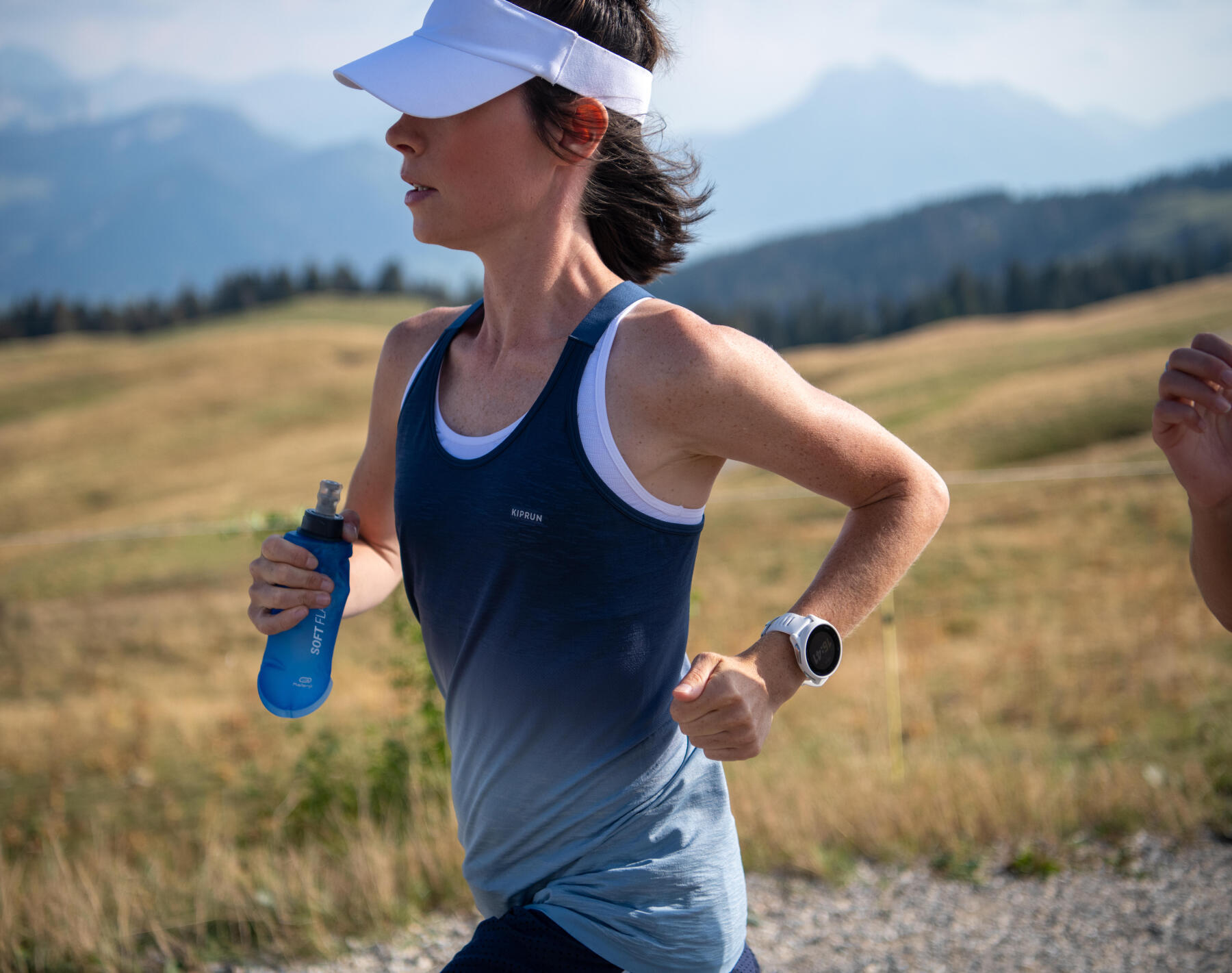 woman running with her water bottle