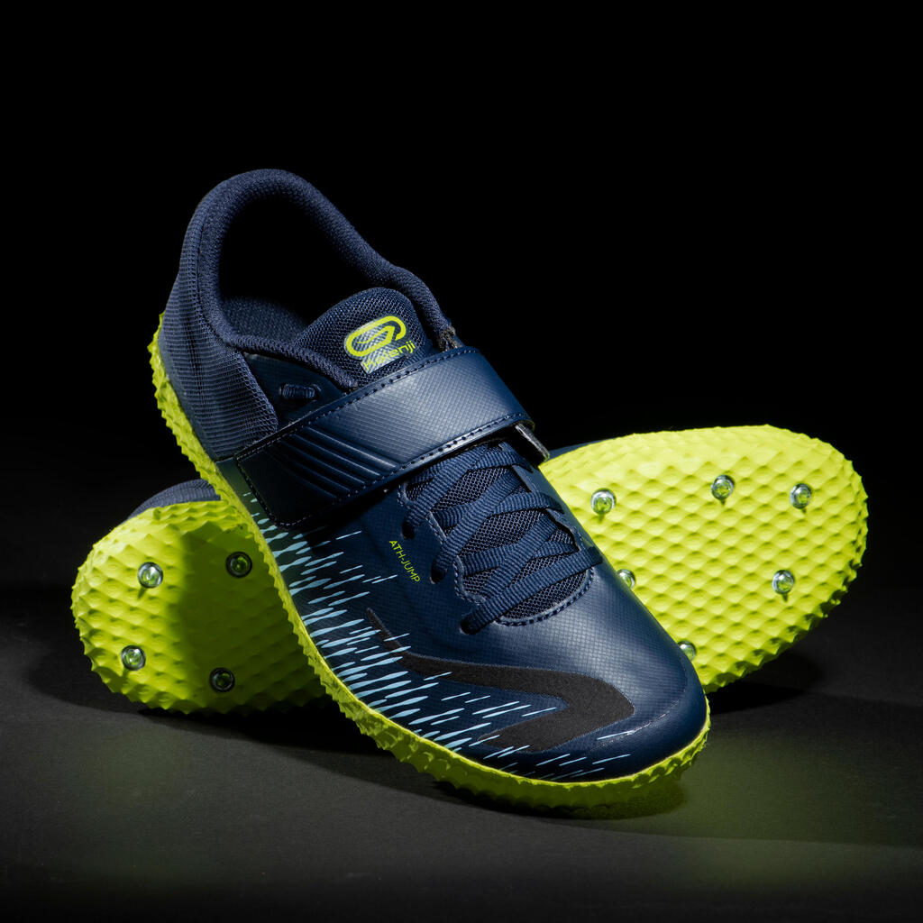 AT HIGH JUMP SPIKED SHOES SPECIFICALLY FOR THE HIGH JUMP