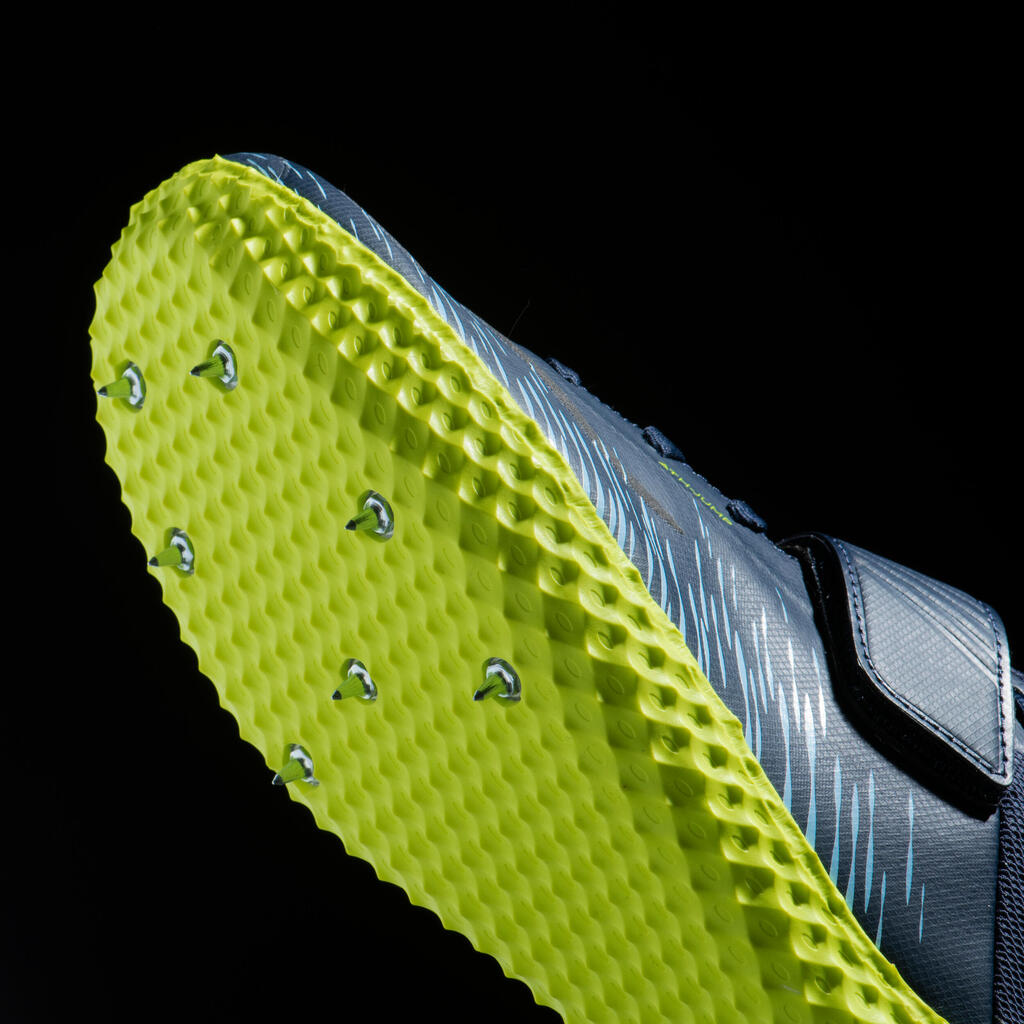 AT HIGH JUMP SPIKED SHOES SPECIFICALLY FOR THE HIGH JUMP