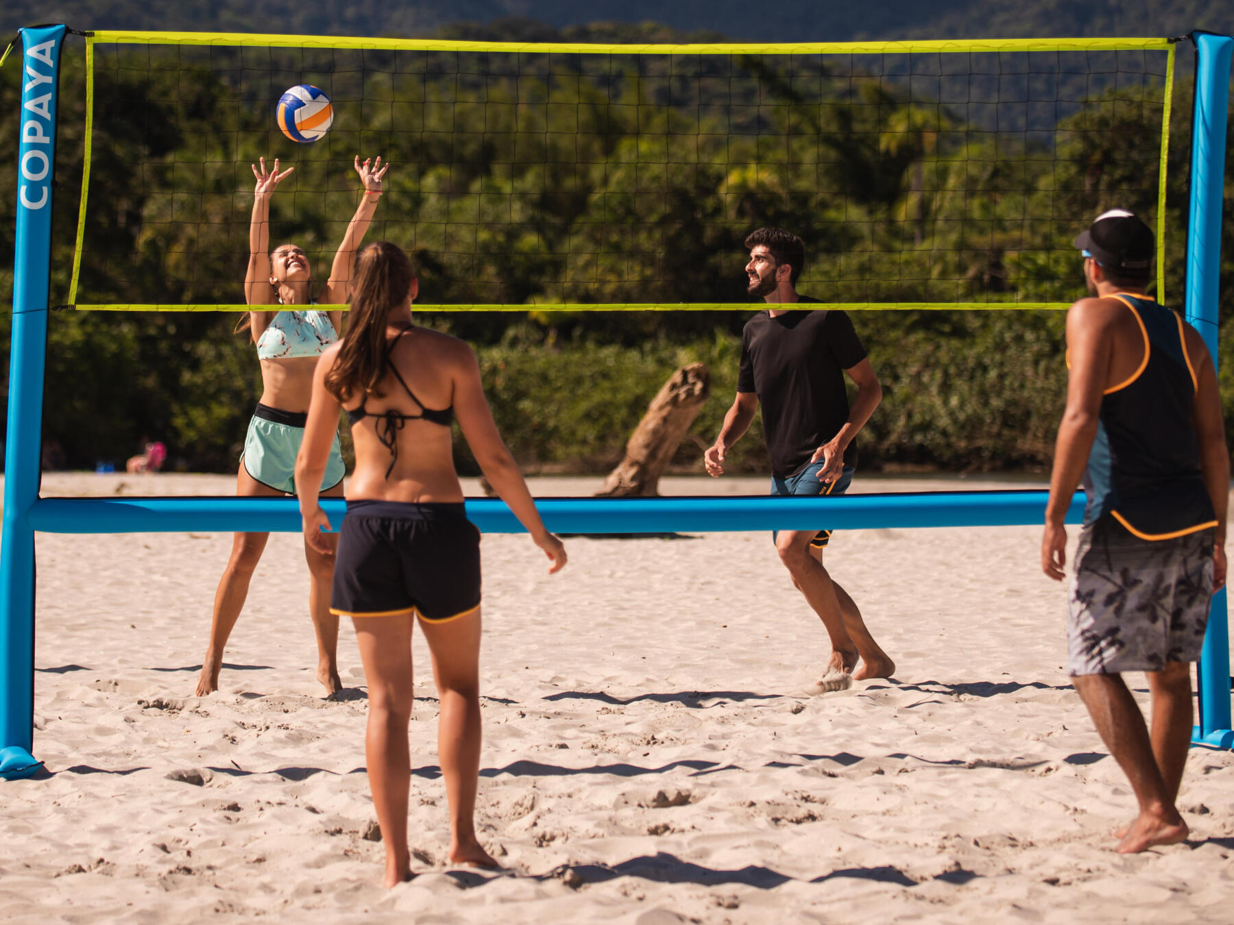 people playing beach volleyball