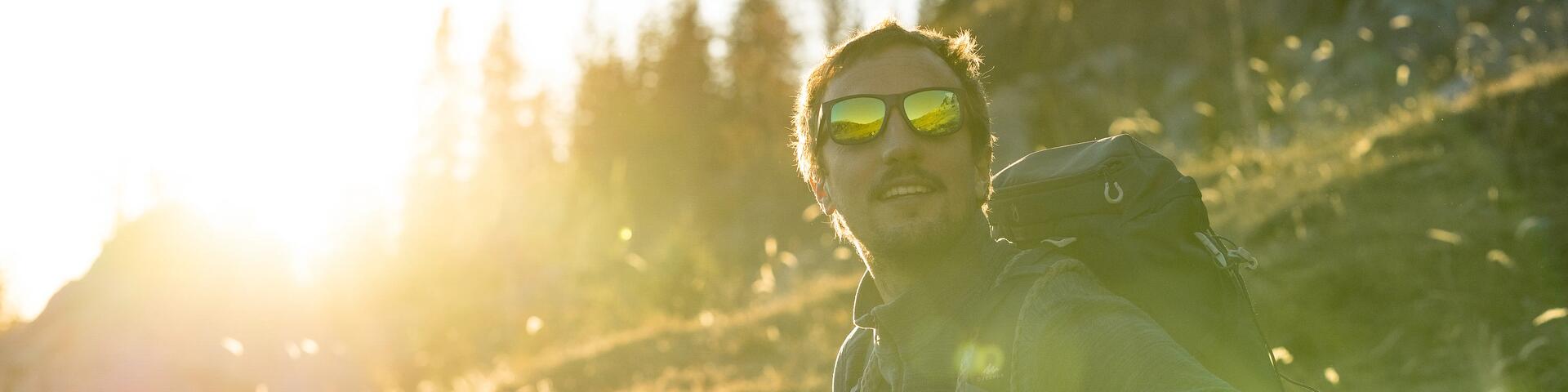 How should you clean your sunglasses?