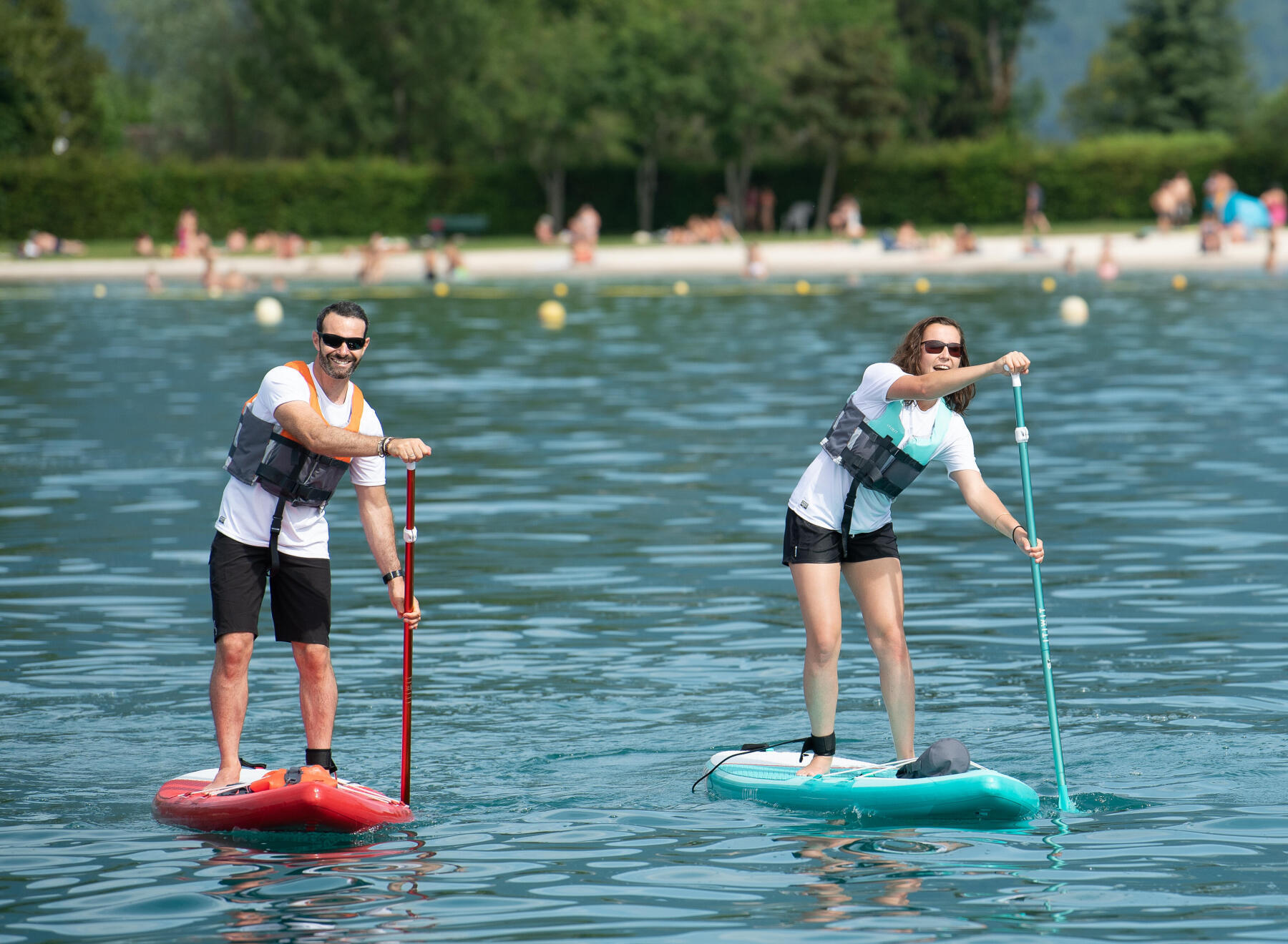 two people paddling on a lake