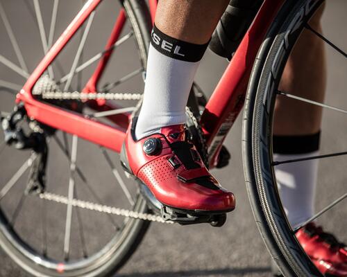 Close up picture of a foot on a bike pedal