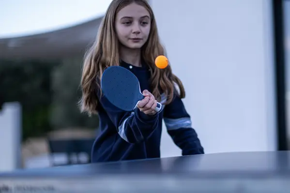 Image of 3 persons using stand-up paddles