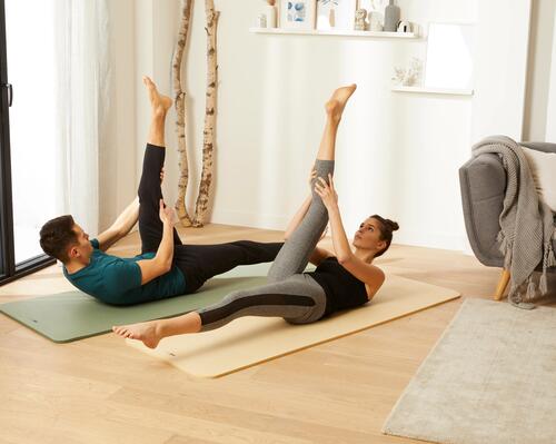 A couple traiing at home on some Nyamba Pilates mats