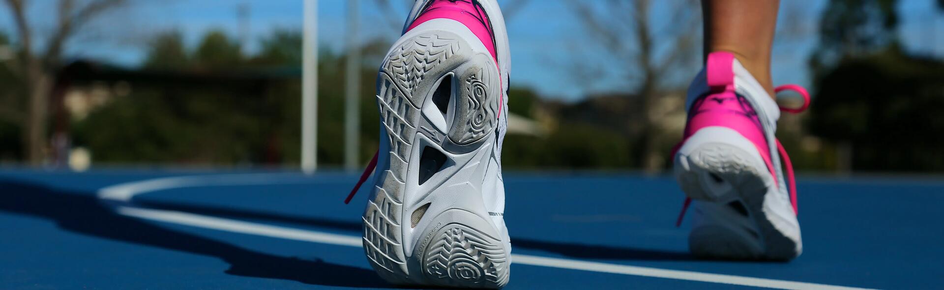 Close-up of trainers of woman walking away
