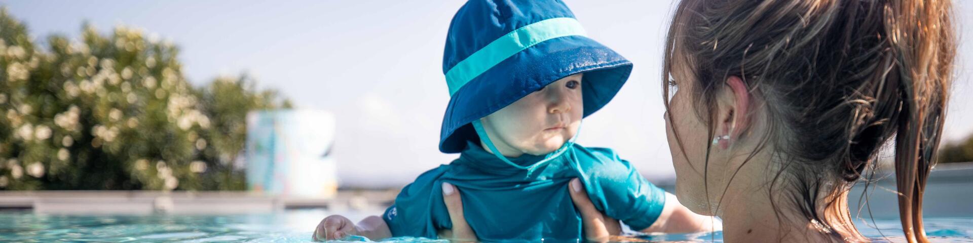 Baby in a pool with his mom