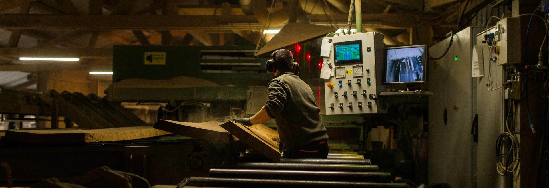 Picture of a man cutting woods