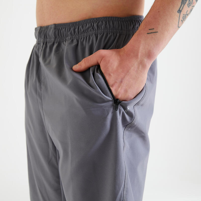 Short de fitness essentiel respirant poches zippés homme - gris