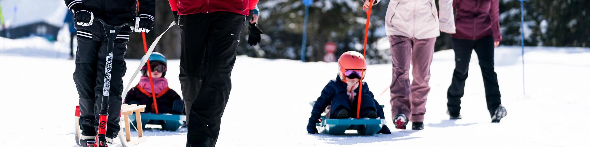 Family taking the kids sledging