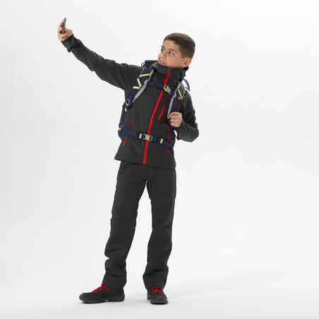 KIDS’ SOFTSHELL HIKING JACKET - MH550 BLACK RED - 7–15 YEARS