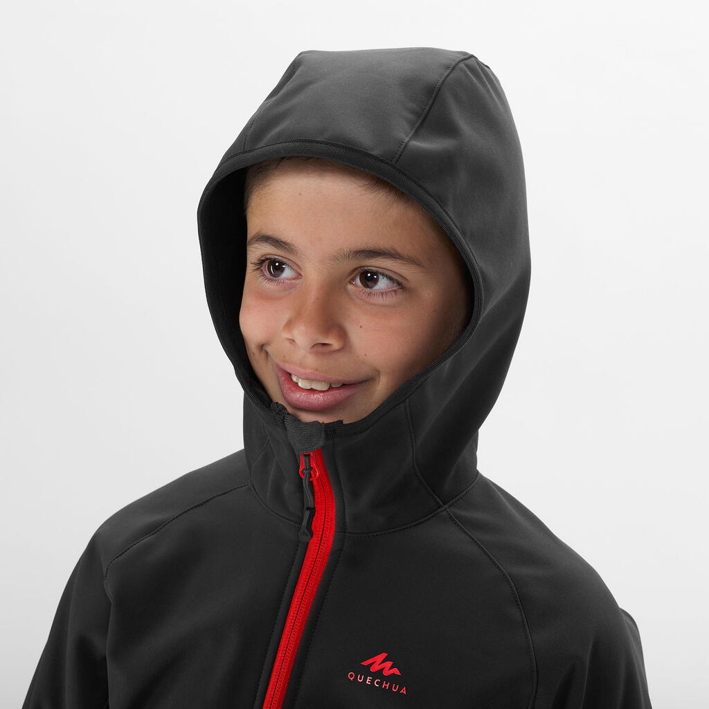 KIDS’ SOFTSHELL HIKING JACKET - MH550 BLACK RED - 7–15 YEARS