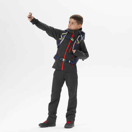 KIDS’ SOFTSHELL HIKING JACKET - MH550 BLACK RED - 7–15 YEARS