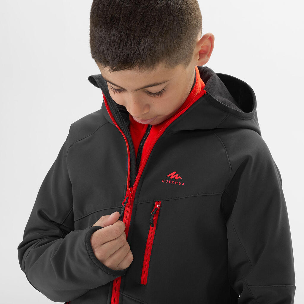 KIDS’ SOFTSHELL HIKING JACKET - MH550 BLACK RED - 7–15 YEARS