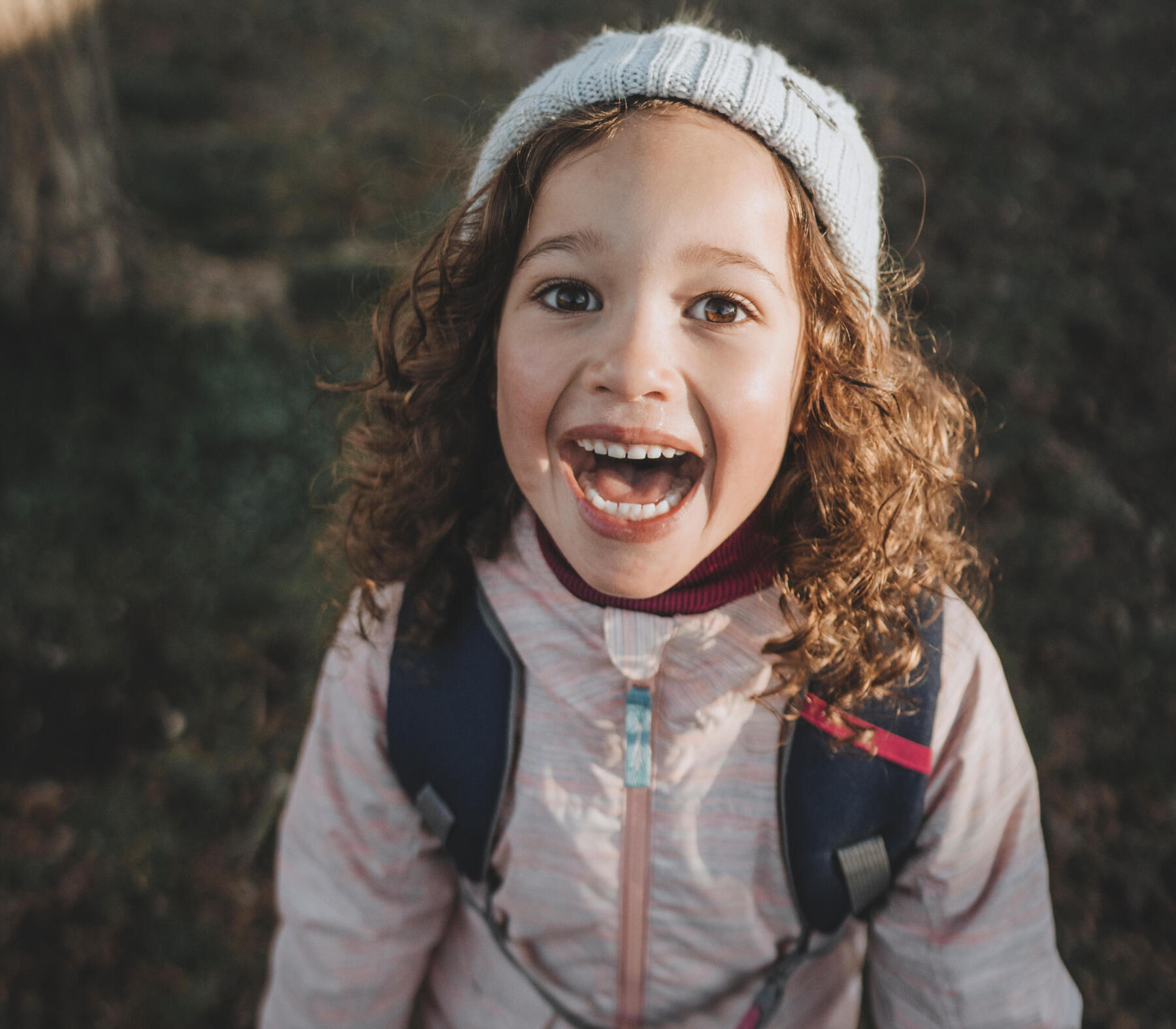 little girl smiling while hiking