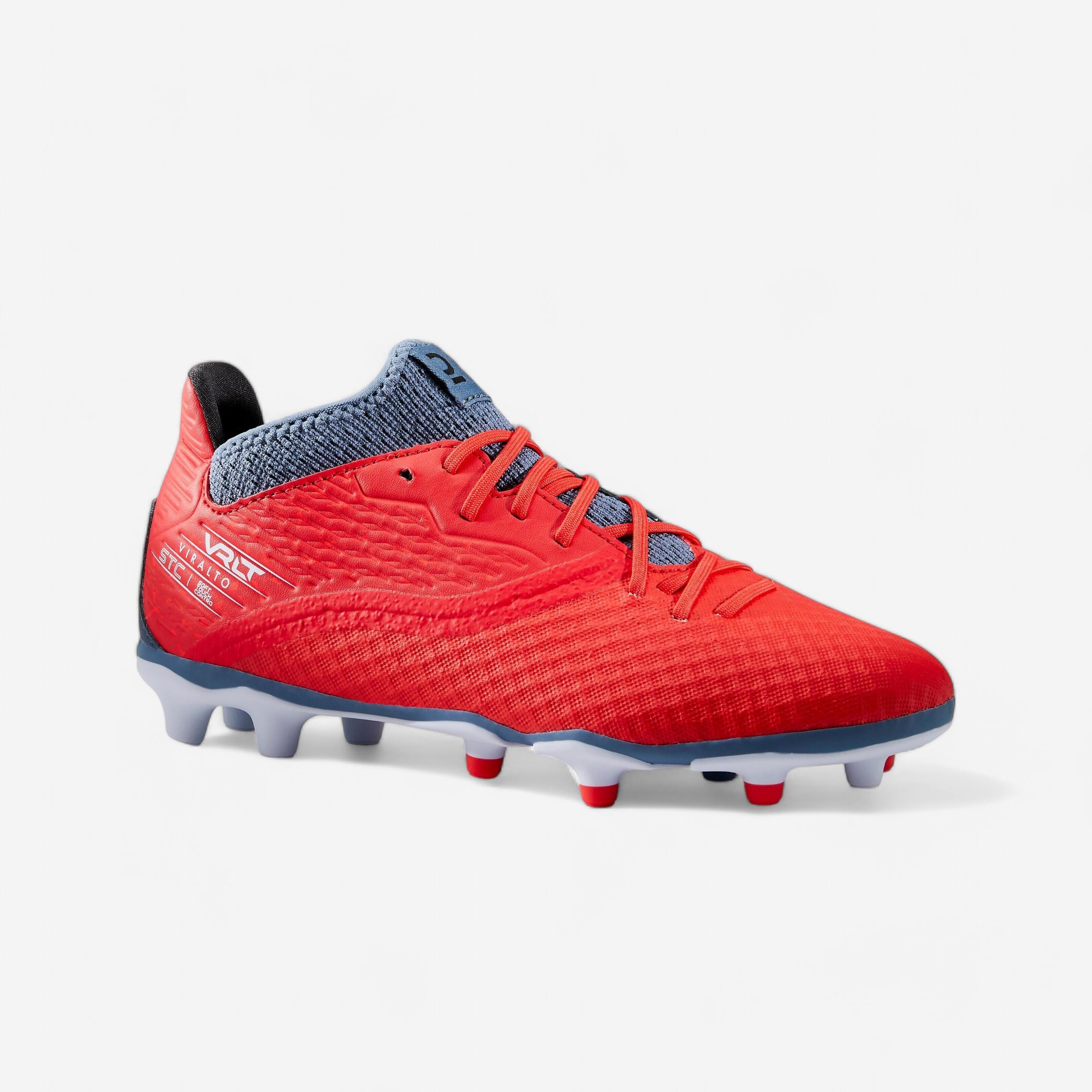grey and red football boots
