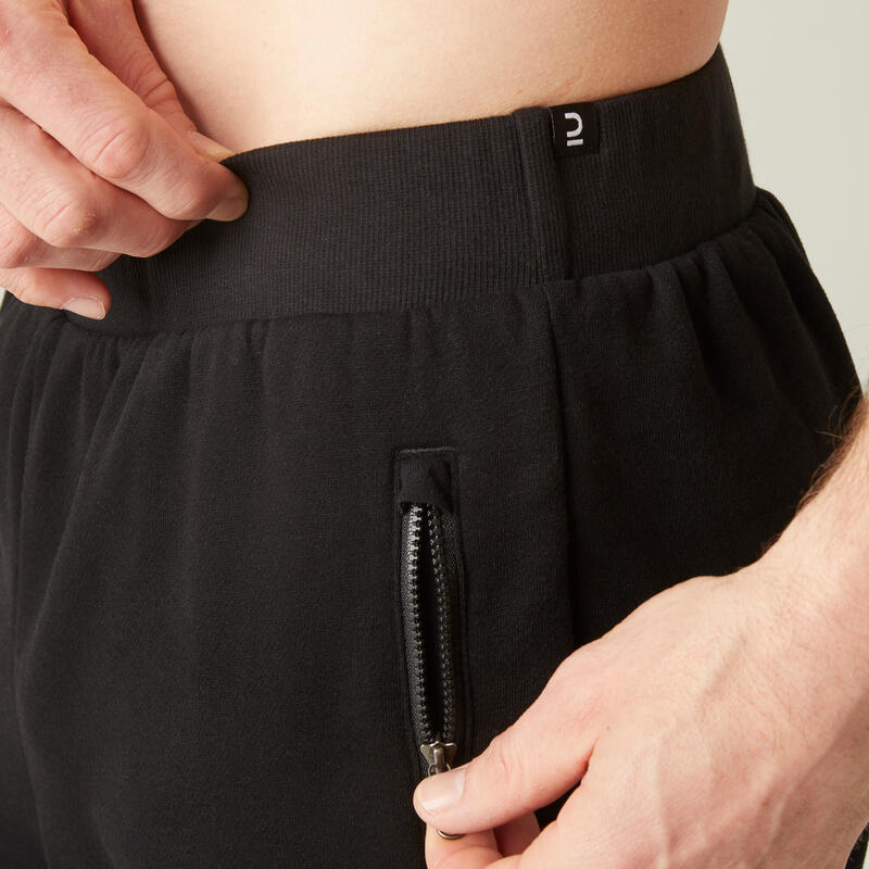 Pantaloni uomo fitness 500 regular misto cotone felpati tasca con zip neri