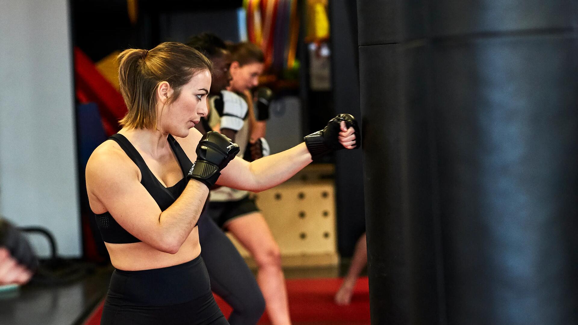 woman concentrated during a boxing class