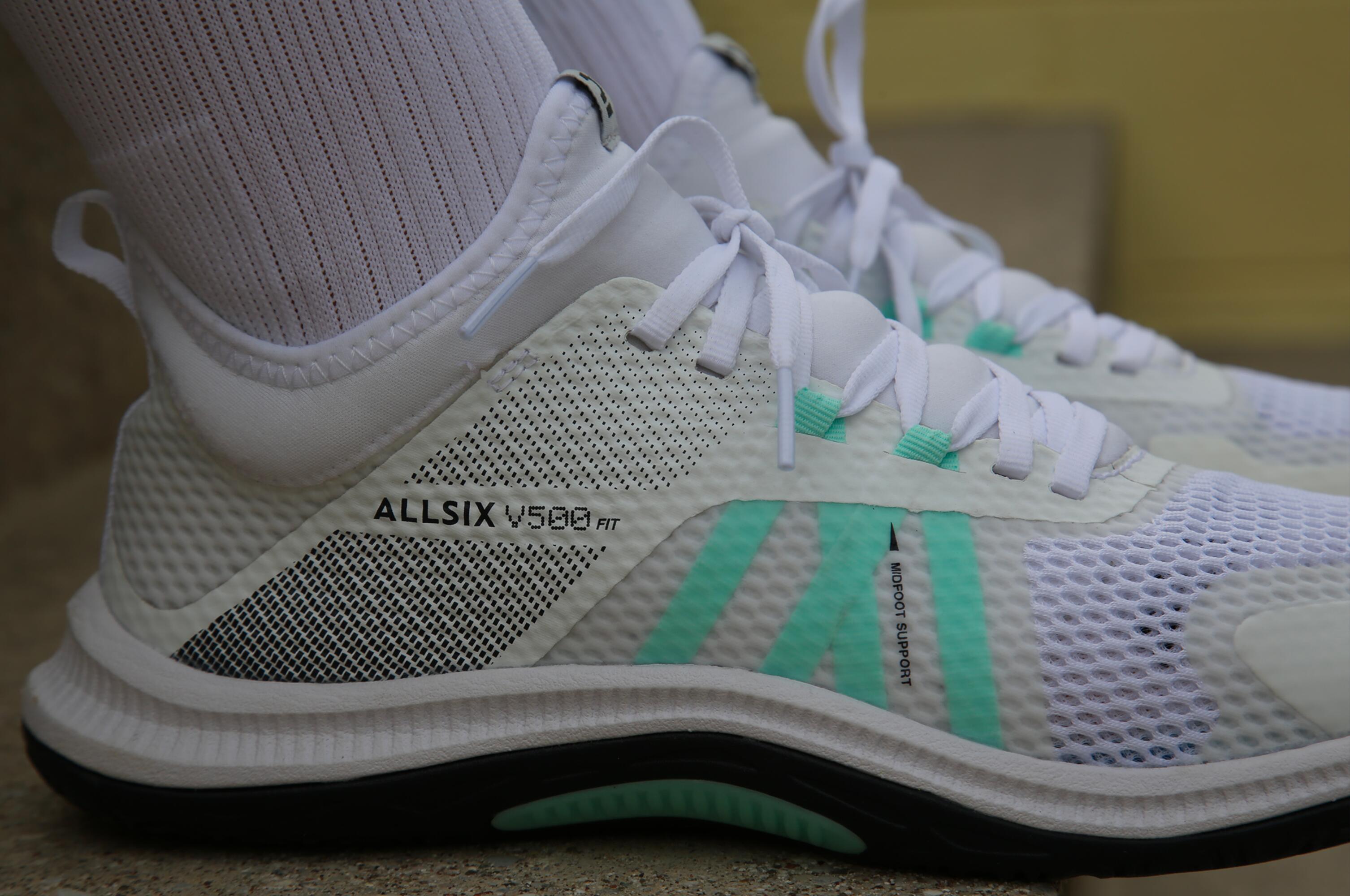 green and white volleyball shoes