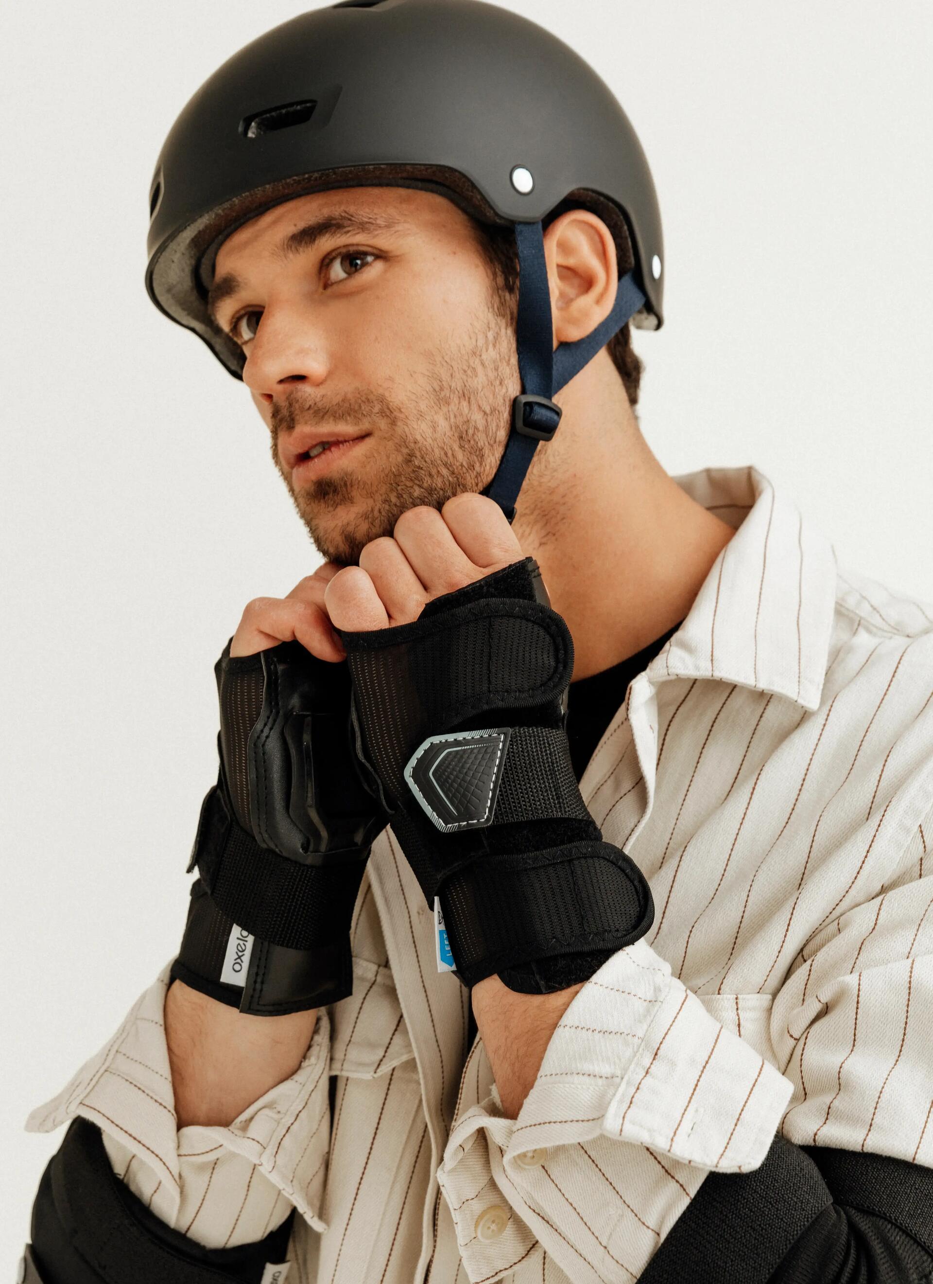 Man fixing his helmet strap