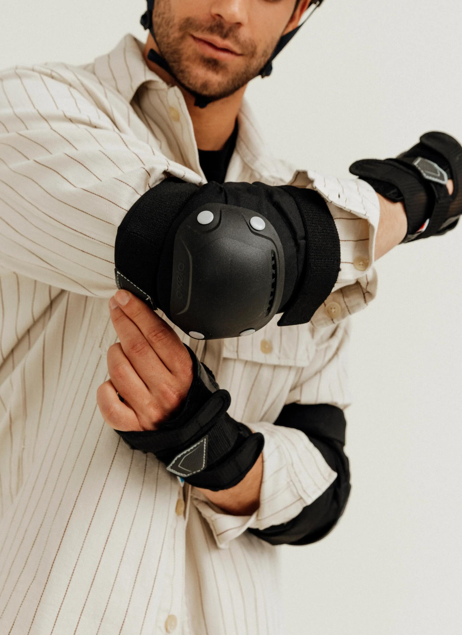 Man adjusting his elbow pads