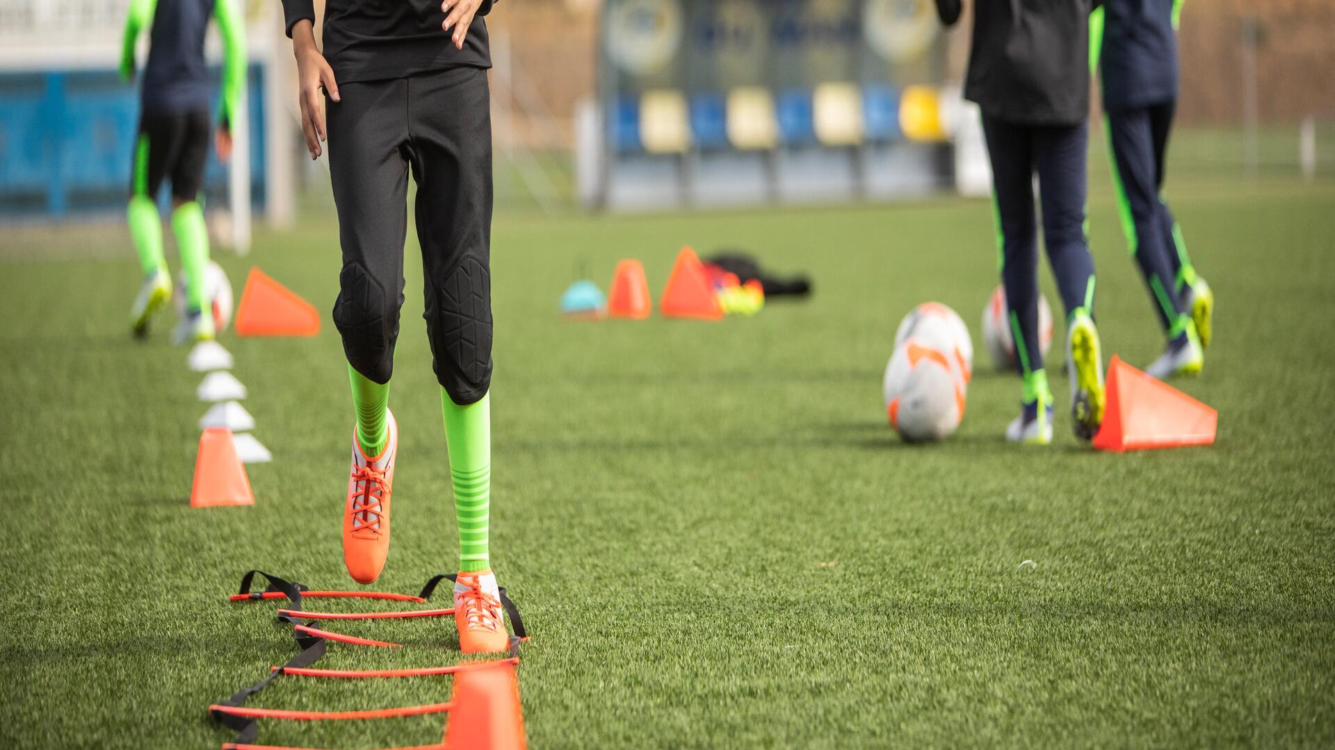 kid training on the soccer field
