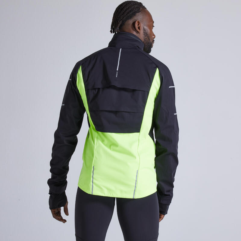 Chaqueta running Hombre cortaviento perlante Kiprun Warm negro amarillo