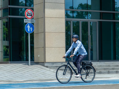 man cycling in city