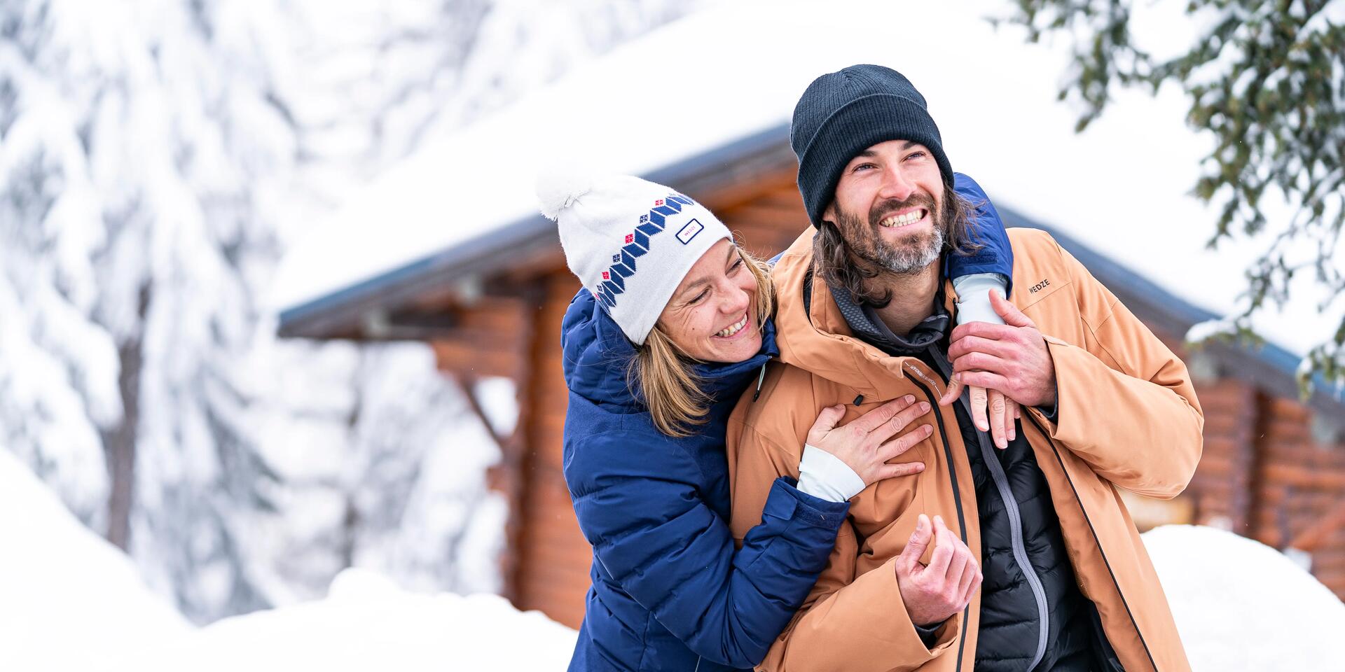 Couple hugging, wearing winter jackets