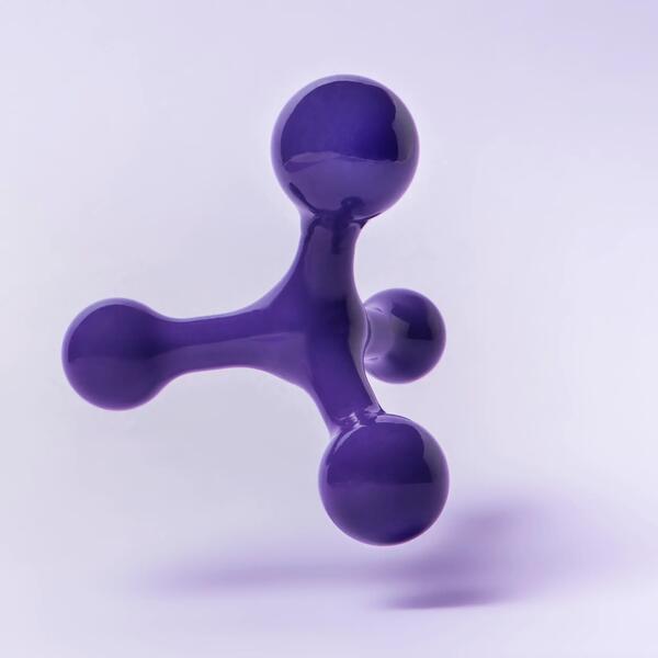 Handheld massage tool with four knobs