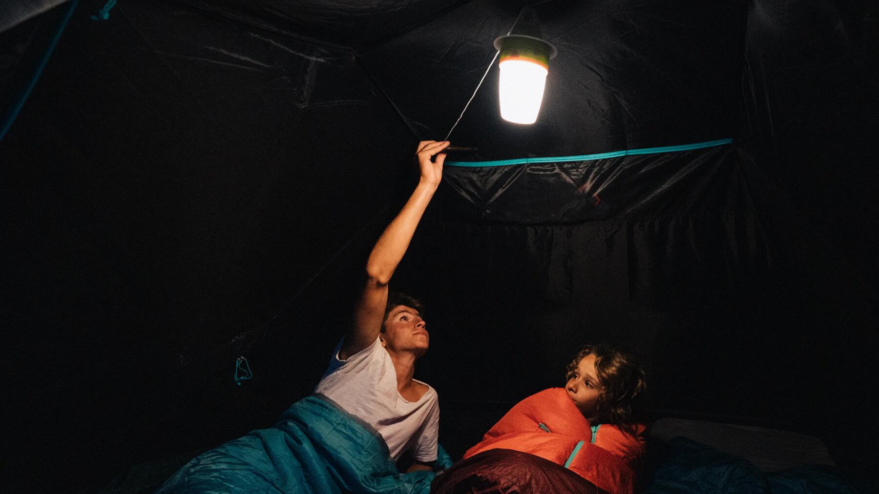  A group of people gathered around a camping table 