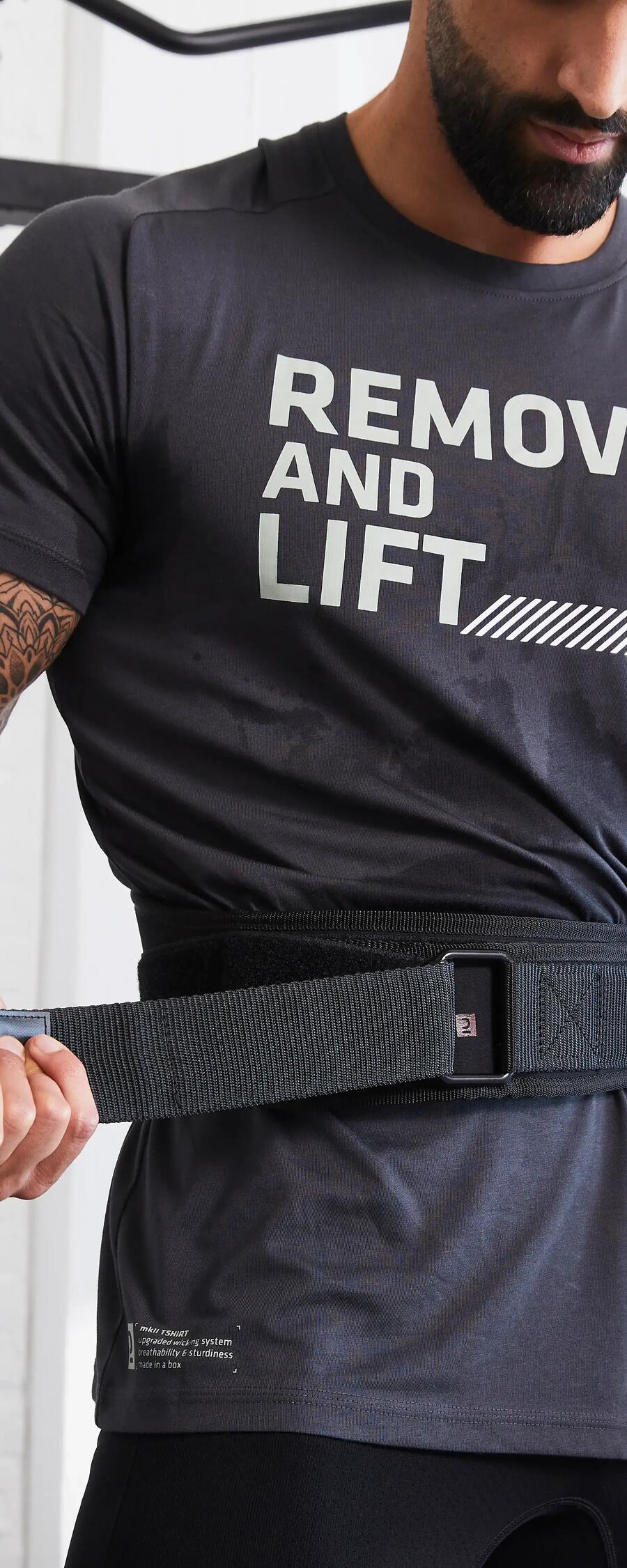 Man putting on weightlifting belt