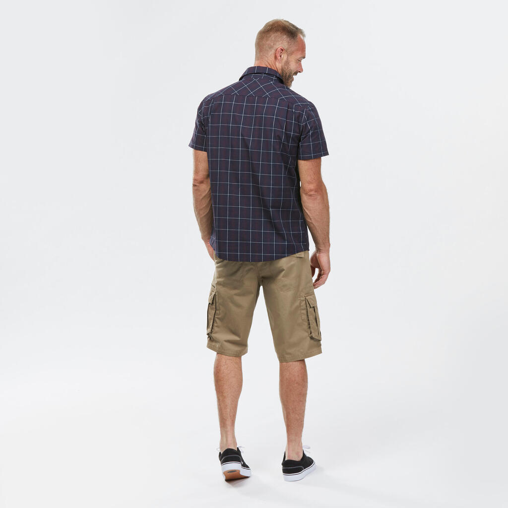 CAMISA MANGA CORTA TREKKING VIAJE HOMBRE TRAVEL100 AZUL