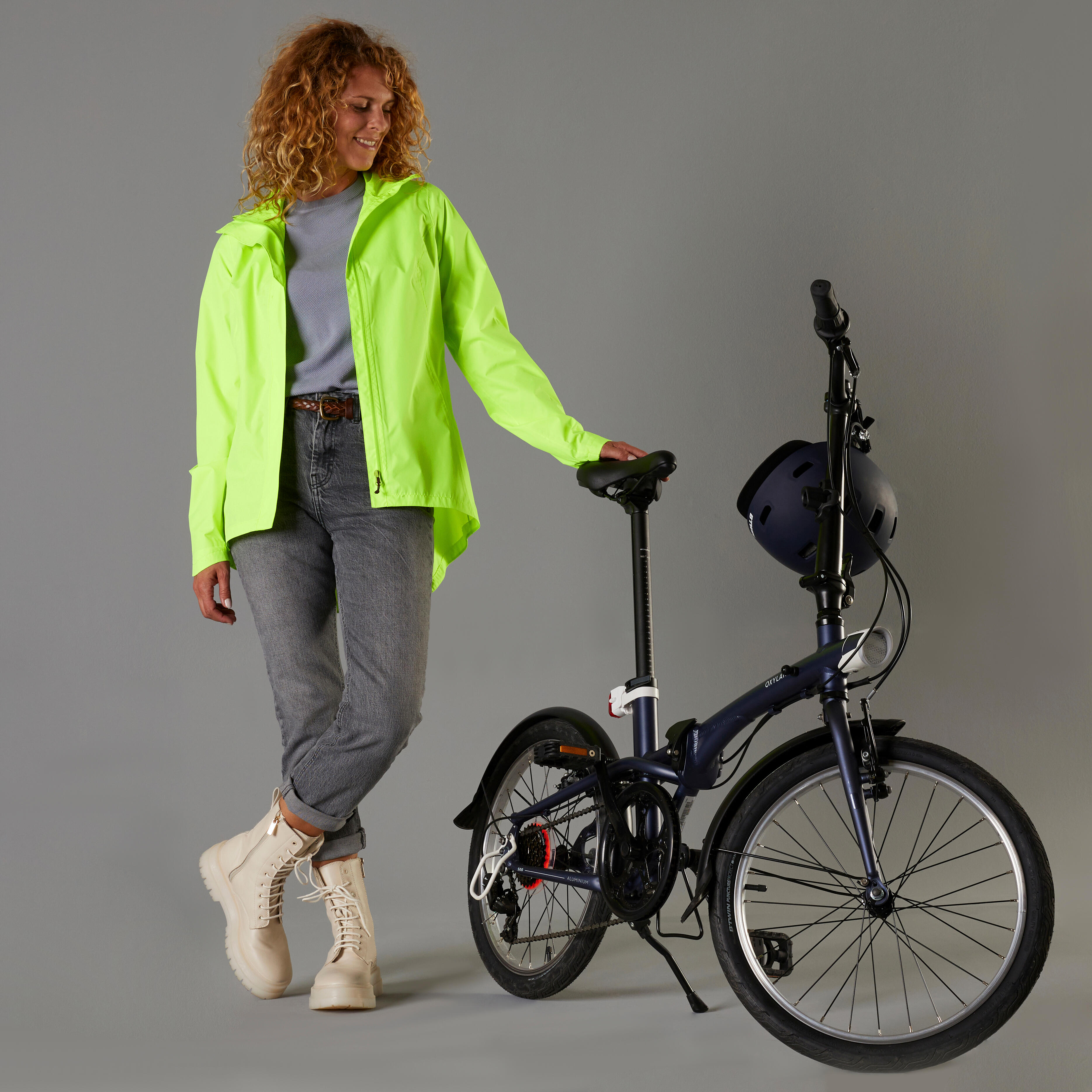 100 women s waterproof urban cycling jacket neon yellow