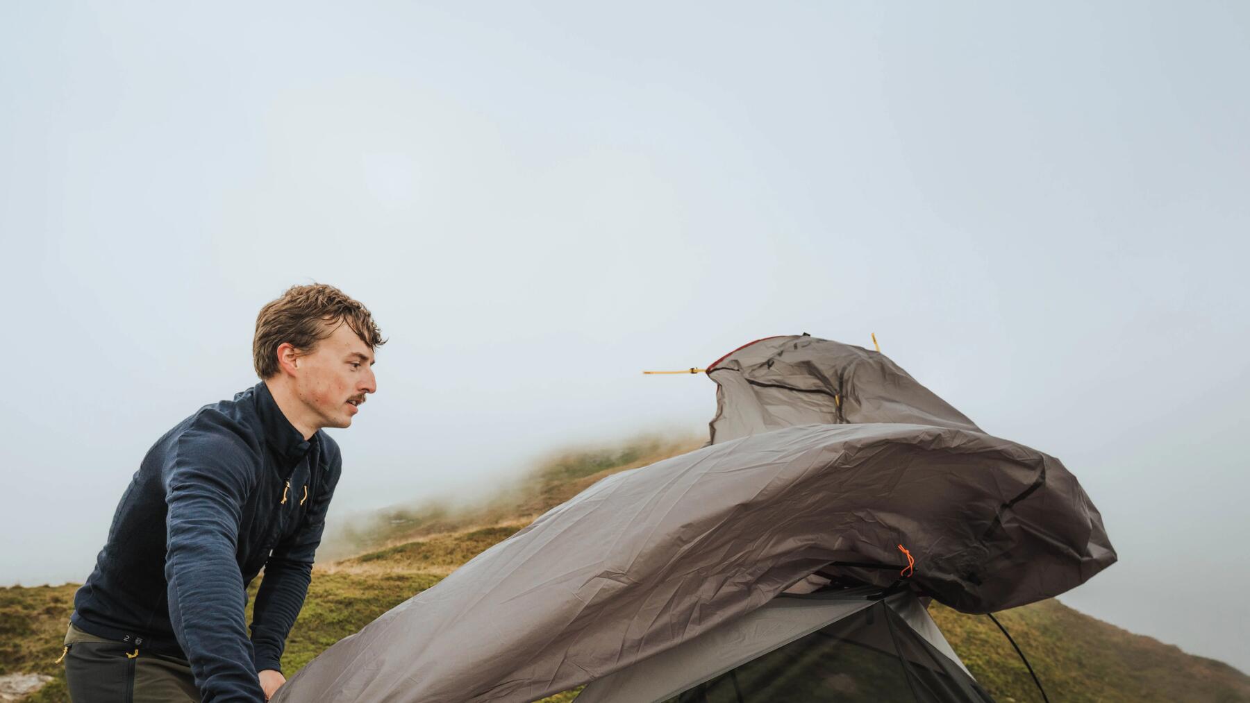  A group of people gathered around a camping table 