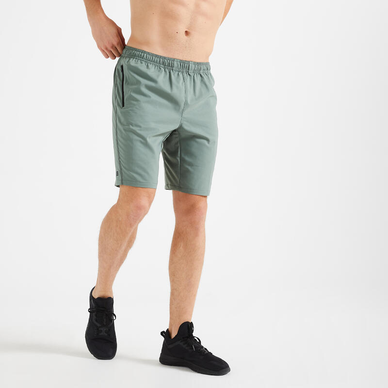 Short de fitness essentiel respirant poches zippés homme - vert uni