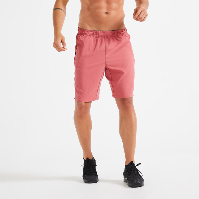 Short de fitness essentiel respirant poches zippés homme - rose uni