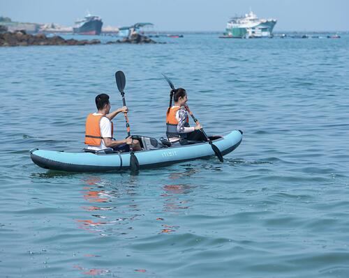 Two people rowing a kayak