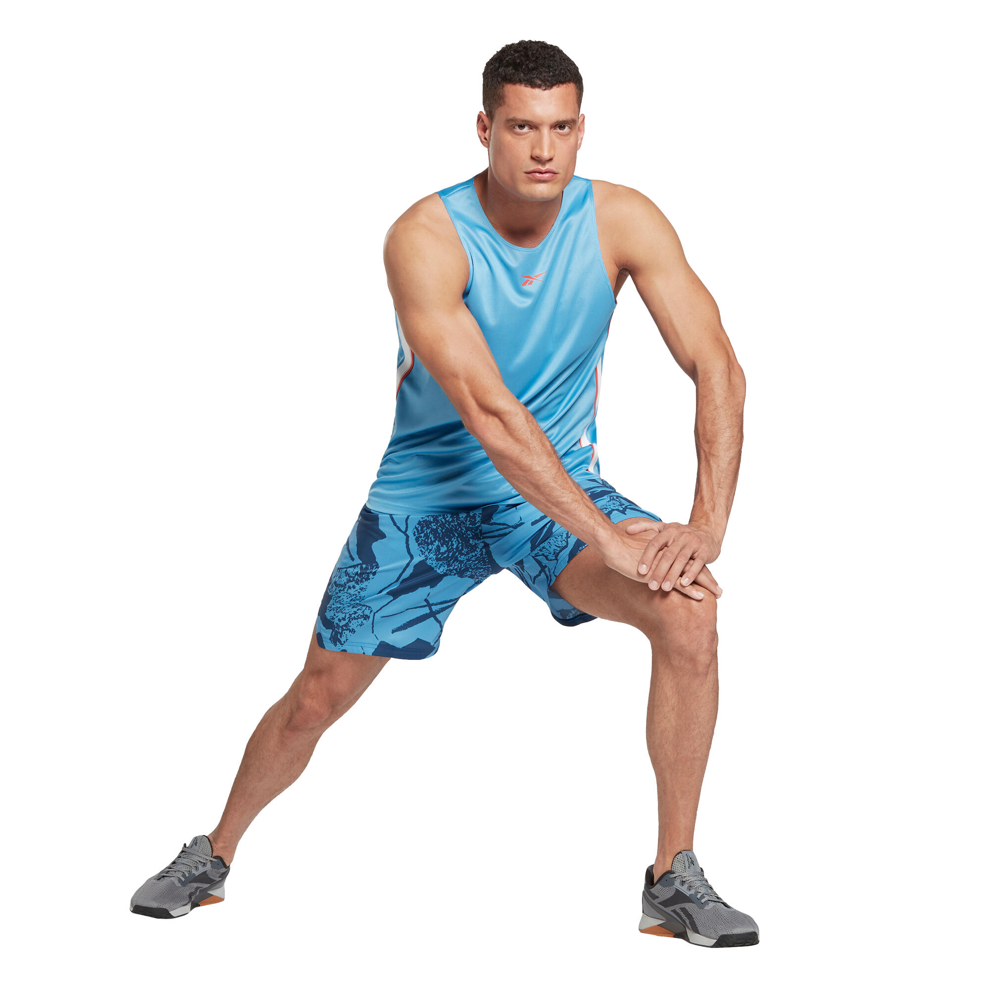 Pantaloncini cardio fitness uomo Reebok Wor aop traspiranti azzurri REEBOK  | DECATHLON