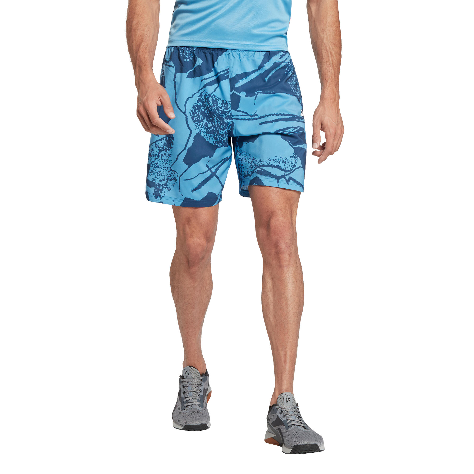 Pantaloncini cardio fitness uomo Reebok Wor aop traspiranti azzurri REEBOK  | DECATHLON