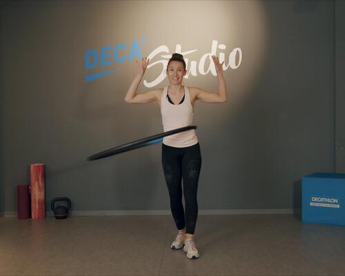 woman using weighted hula hoops 