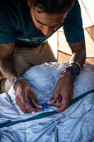 Multi-purpose repair adhesive patches for tents, sleeping bags, backpacks.